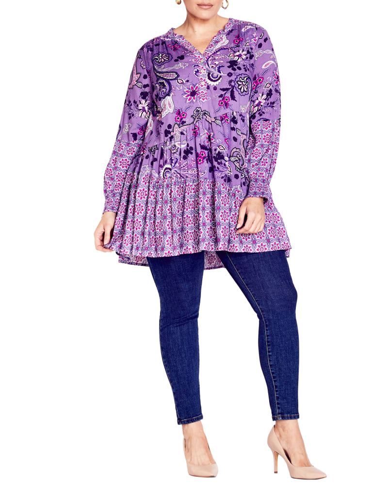 Front of a model wearing a size 18 TUNIC CYNTHIA SPLICE in Purple Paisley Swirl by avenue. | dia_product_style_image_id:320425